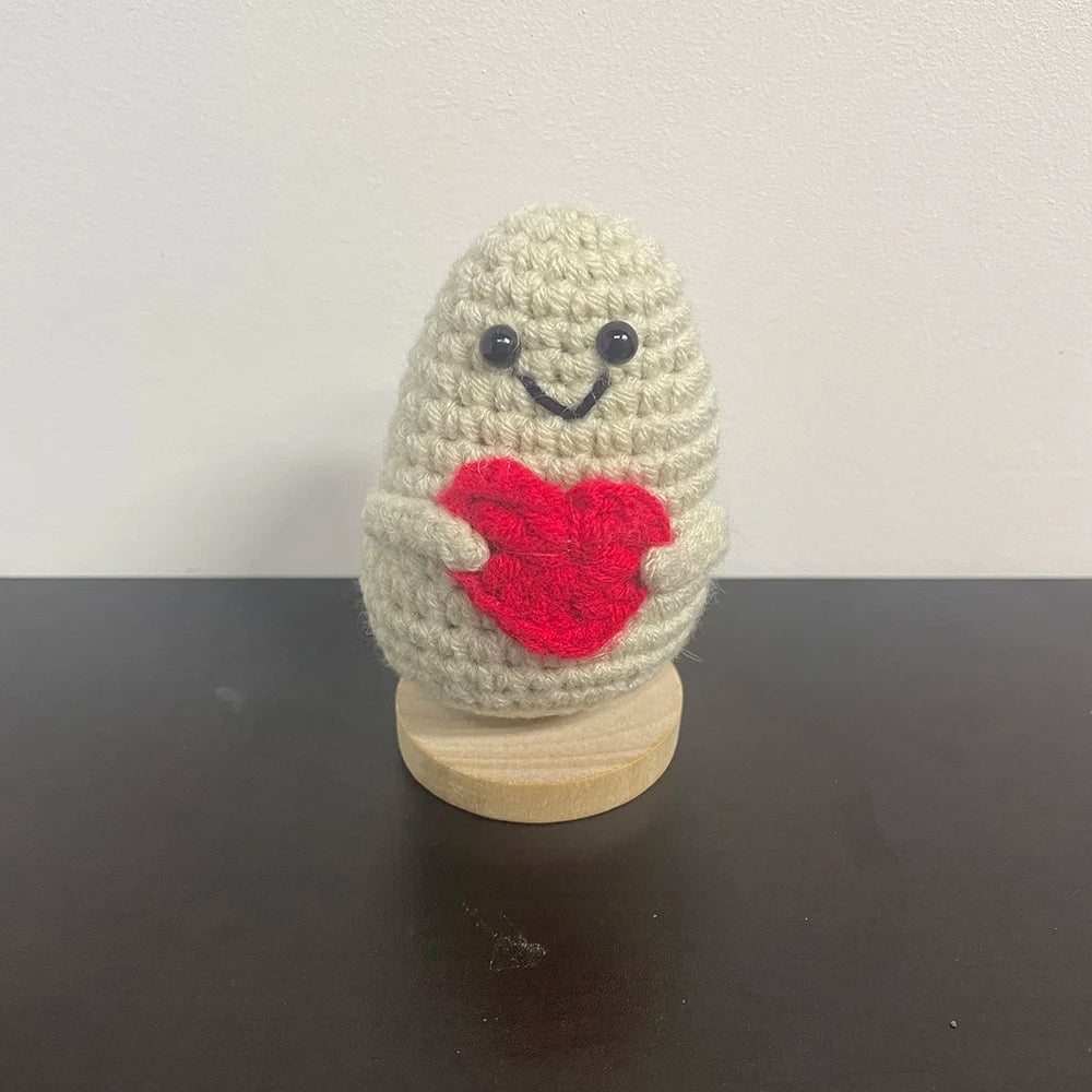 Handmade crochet plush holding a red heart, perfect amigurumi gift for Valentine's Day or anniversaries